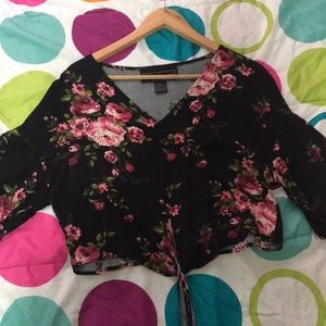 A black cropped floral shirt